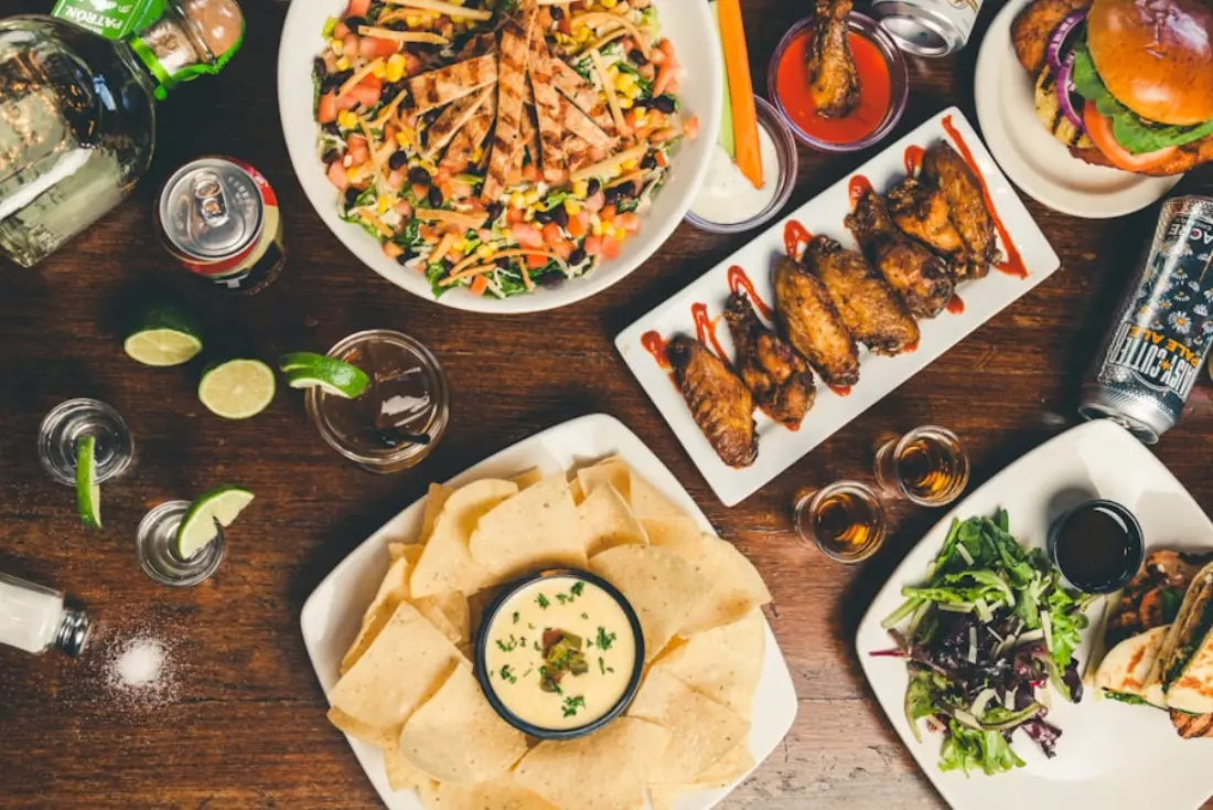 A table spread with curries, rice, breads and chutneys